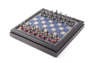 A Battle of Waterloo Franklin Mint 1984 chess set with a matching chess table.