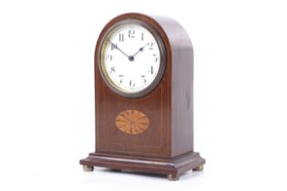 An Edwardian arch shaped inlaid mahogany mantel clock. Buren Swiss made, 8 day movement.