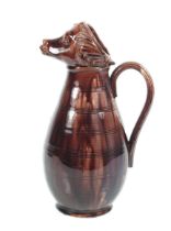 A dark brown glazed ewer.