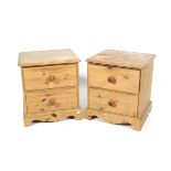 A pair of pine bedside cabinets.