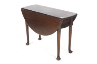 An 18th century mahogany circular drop flap gate leg table.