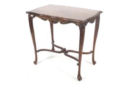 Early 20th Century mahogany side table on carved cabriole supports.