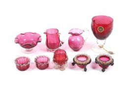A collection of Victorian and later cranberry glassware.