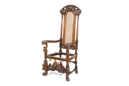 A 19th century Jacobean style caned back walnut throne chair.