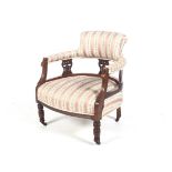 A 19th century mahogany nursing chair.