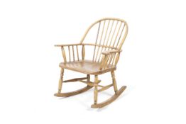 An elm seated stick back rocking chair.