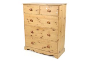 A contemporary pine chest of drawers.