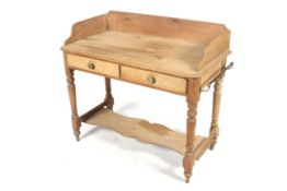 An Edwardian pine two drawer wash stand.