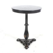 A Regency black lacquer occasional table.