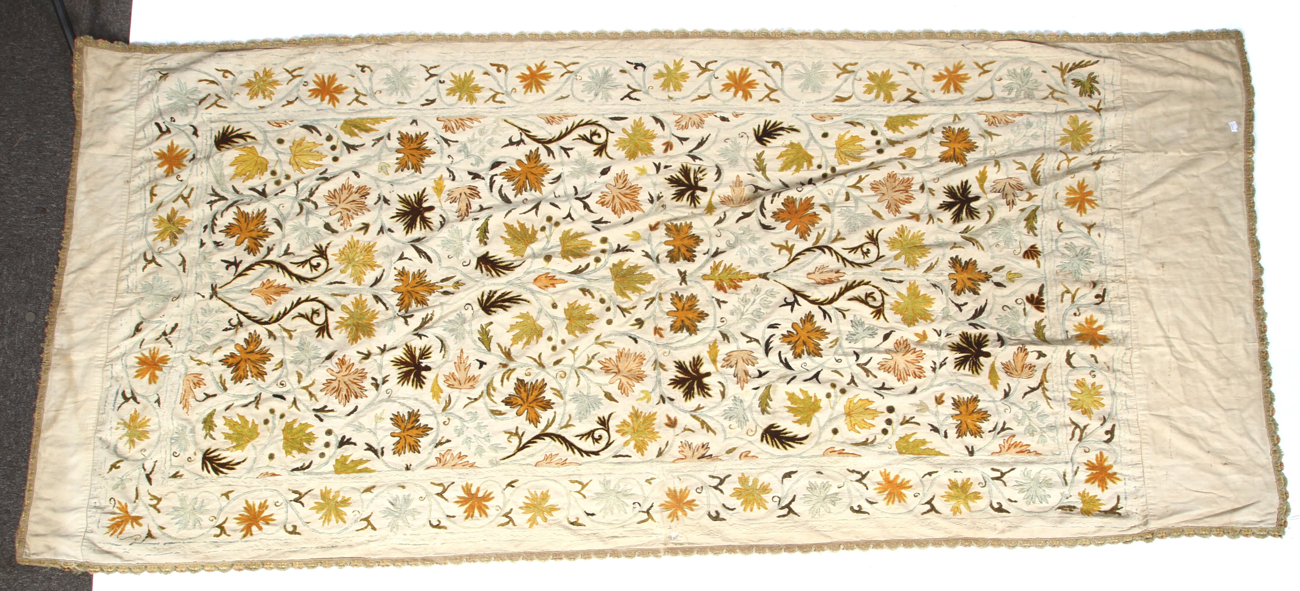 A early 20th century single bed hand embroidered (crewel work) bedspread.