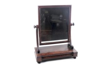 An Edwardian mahogany vaneered dressing swing mirror.