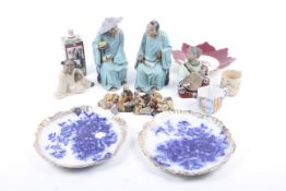 An assortment of ceramics to include Chinese figures,