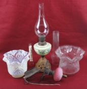 A collection of vintage oil lamp components.