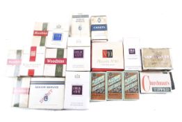 Eighteen vintage cigarette boxes.
