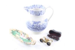A large 19th century water jug, a porcelain tray and a pair of opera glasses.