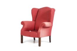 A contemporary Victorian style upholstered wing back armchair.