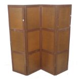 An early 20th century wooden panelled four fold dressing screen.