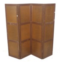 An early 20th century wooden panelled four fold dressing screen.