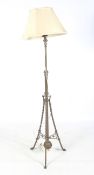 A late 19th century Aesthetic Movement brass telescopic standard lamp.