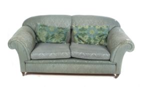 A 20th century Howard style srcoll arm sofa.