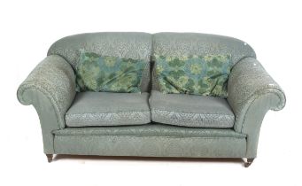 A 20th century Howard style srcoll arm sofa.