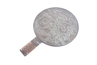 An oriental bronze hand mirror.