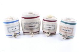 A group of four assorted vintage Wade Pottery drinks barrels. Including Port, Gin and Sherry. Max.