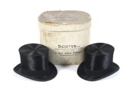 Two brushed silk top hats by Herbert Johnson of London, in a Scotts Ltd hat box.