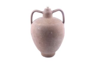 An unglazed terracotta twin handle 'Amphora' storage jar. Wheel thrown body with applied handles.
