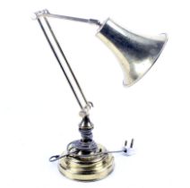 A vintage brass desk lamp. With an adjustable stem, mounted on a stepped circular base, Max.