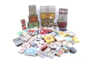 A collection of vintage product advertising tins and cigarette packets.
