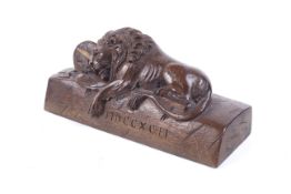 A vintage 'Lion of Lucerne' wood carving. Carved with Roman numerals to the front for the year 1792.
