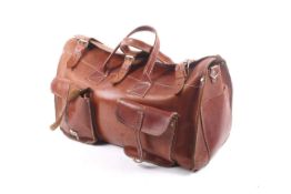 A vintage tan leather weekend holdall bag.