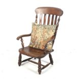 A 19th century Windsor open armchair.