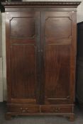 A 19th century mahogany two door wardrobe, with two drawers under, on bracket feet.