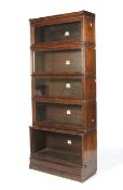 A stained beech five-section glazed display case by 'The Globe-Wernicke Co Ltd,