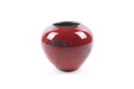 A signed Art Studio pottery red glaze globular vase.