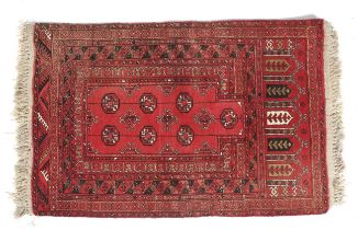 A hand woven wine red ground prayer rug.