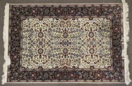 A Hereke Yun Persian hand made carpet of wool on cotton.