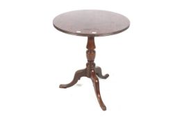 Circa 1900, a mahogany circular pedestal tripod table, 71cm H, 61cm diameter.