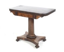 A Regency dark rosewood (almost coromandel) pedestal foldover card table.