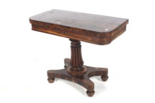 A George IV rosewood fold over card table.