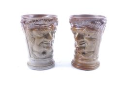 A pair of unusual salt glazed stoneware beakers.
