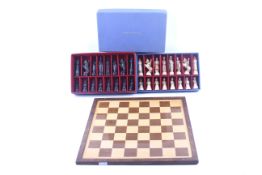 An Italian Toriart 'Charlemagne' complete chess set and wooden board. Boxed.