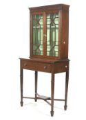 An Edwardian mahogany stained astragal display cabinet on stand.