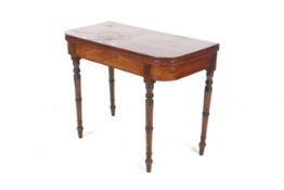 A George IV mahogany card table.