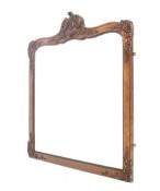 A walnut overmantel mirror. With applied decoration of swags and flowers below a scroll pediment.