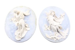 A pair of 19th century plaster wall plaques.