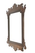 A late 19th to early 20th century mahogany Chippendale style fretwork wall mirror.