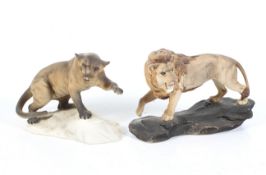 Two matt glaze Beswick figurines of a lion and a mountain cat.
